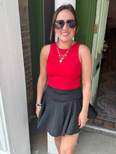 Load image into Gallery viewer, Solid color athletic skorts feature under shorts w/pockets