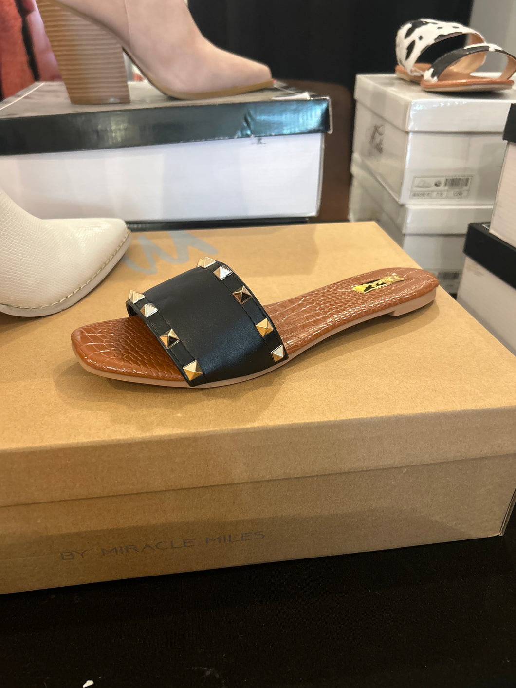 Black studded slides